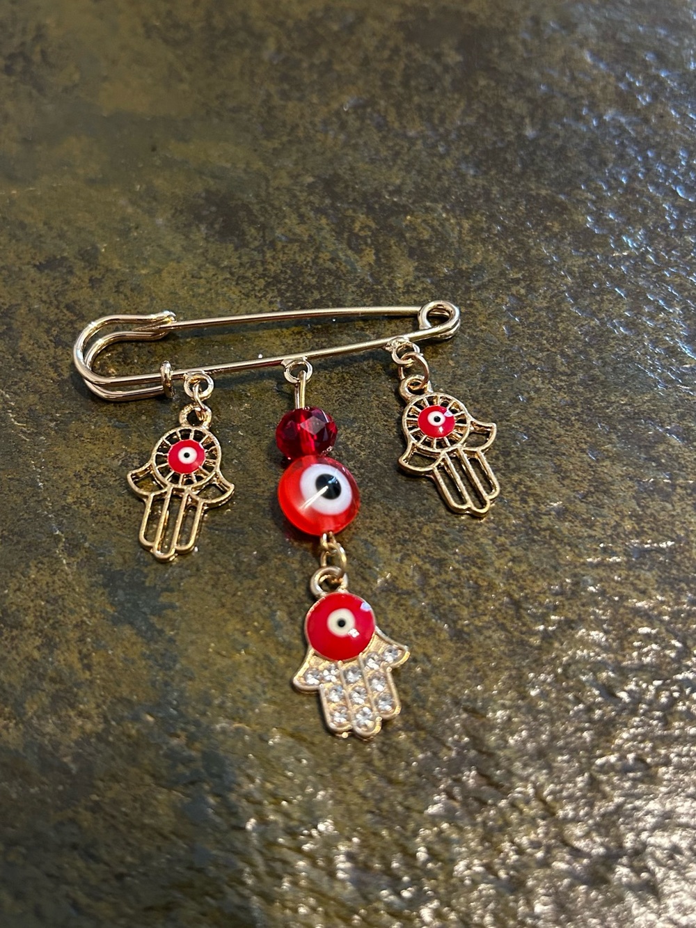 Gold Tone Hamsa & Red Evil Eye Safety Pin Charm.